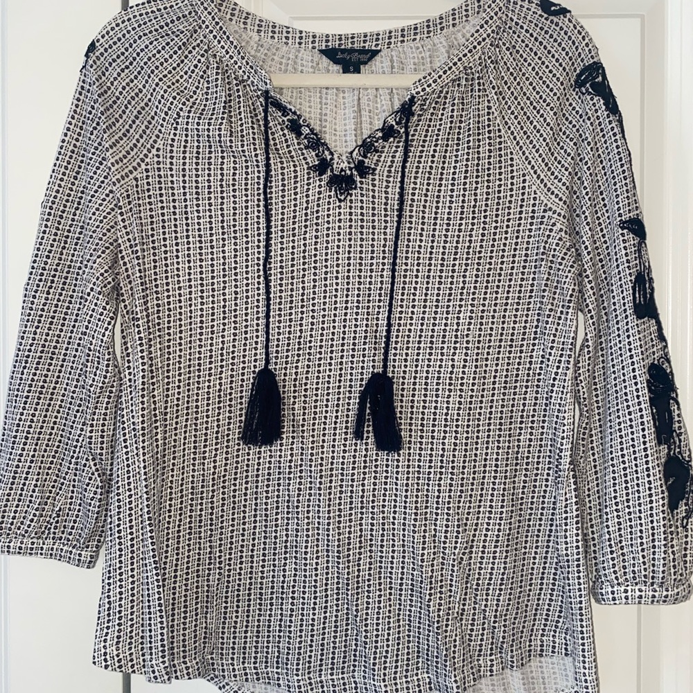 Black and white embroidered blouse.